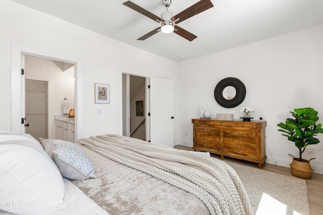 1408 Sawyer Rd Unit 103, Raleigh, NC 27610 - bedroom with wood finished floors, ceiling fan, and a walk in closet