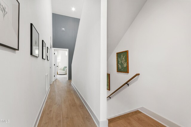 1408 Sawyer Rd Unit 103, Raleigh, NC 27610 - corridor featuring an upstairs landing, light wood-type flooring, a high ceiling, and recessed lighting