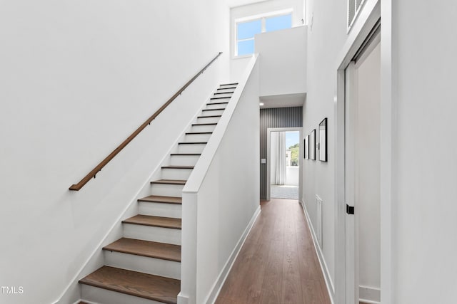 1408 Sawyer Rd Unit 103, Raleigh, NC 27610 - staircase with wood finished floors and a high ceiling