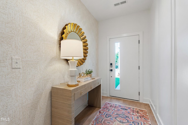 1408 Sawyer Rd Unit 103, Raleigh, NC 27610 - foyer entrance featuring light wood finished floors and baseboards