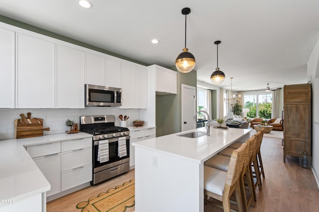 1408 Sawyer Rd Unit 103, Raleigh, NC 27610 - kitchen featuring stainless steel appliances, backsplash, light countertops, and recessed lighting
