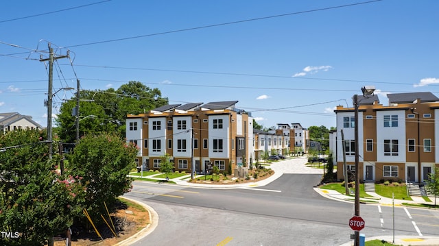 1408 Sawyer Rd Unit 103, Raleigh, NC 27610 - view of asphalt street with street lighting, curbs, and sidewalks