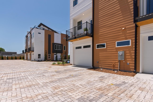 1408 Sawyer Rd Unit 103, Raleigh, NC 27610 - view of side of property with a balcony and decorative driveway