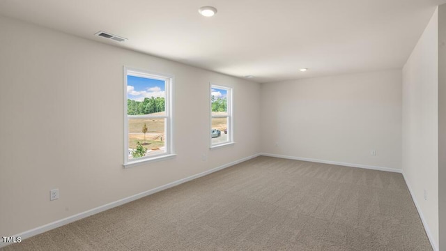 121 Gilmer St, Fuquay Varina, NC 27526 - empty room featuring light colored carpet, baseboards, and recessed lighting