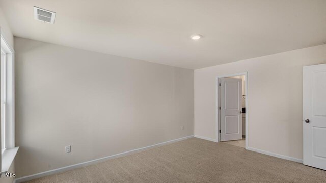 121 Gilmer St, Fuquay Varina, NC 27526 - spare room with light carpet and baseboards