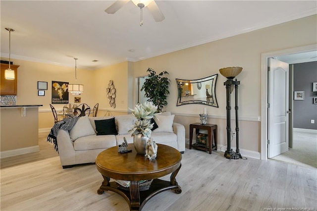 159 Gallery Dr Unit 103, Spring Lake, NC 28390 - living area with light wood finished floors, ceiling fan, baseboards, and crown molding