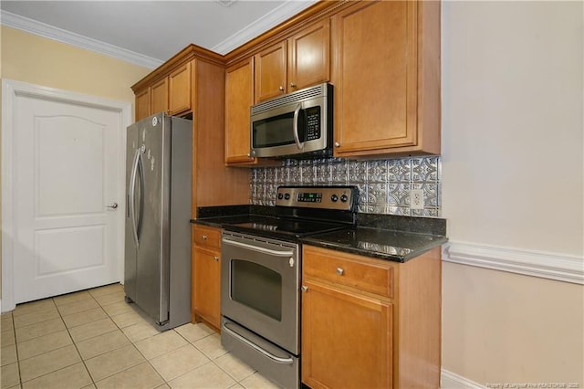 159 Gallery Dr Unit 103, Spring Lake, NC 28390 - kitchen featuring stainless steel appliances, brown cabinets, tasteful backsplash, light tile patterned floors, and dark stone countertops