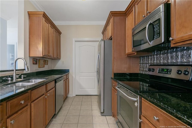 159 Gallery Dr Unit 103, Spring Lake, NC 28390 - kitchen with appliances with stainless steel finishes, a sink, brown cabinets, dark stone countertops, and ornamental molding