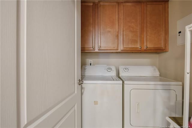 159 Gallery Dr Unit 103, Spring Lake, NC 28390 - laundry room featuring washing machine and clothes dryer and cabinet space