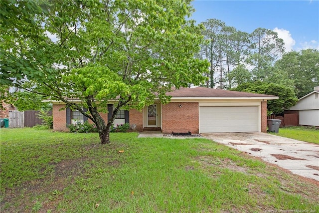 3855 Sturbridge Dr, Hope Mills, NC 28348 - ranch-style home featuring driveway, a garage, and brick siding