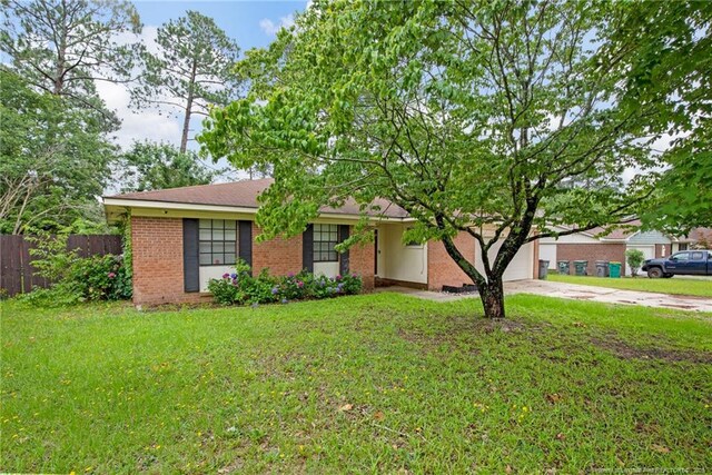3855 Sturbridge Dr, Hope Mills, NC 28348 - ranch-style house with brick siding, driveway, and an attached garage