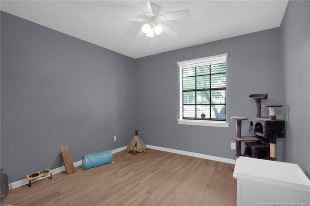 3855 Sturbridge Dr, Hope Mills, NC 28348 - unfurnished room with light wood finished floors, baseboards, and a ceiling fan
