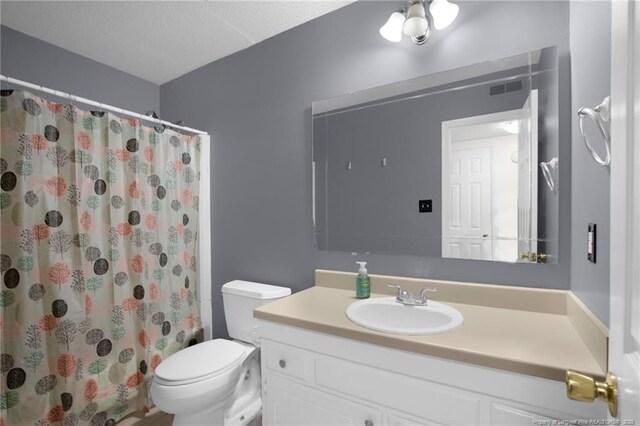 3855 Sturbridge Dr, Hope Mills, NC 28348 - bathroom with vanity, toilet, and a shower with curtain