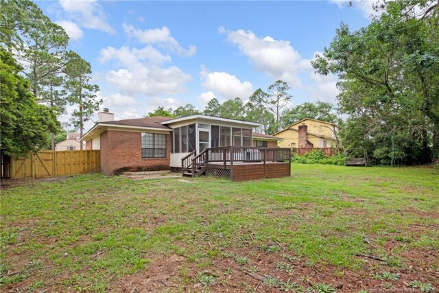 3855 Sturbridge Dr, Hope Mills, NC 28348 - rear view of house featuring a sunroom, a chimney, and brick siding