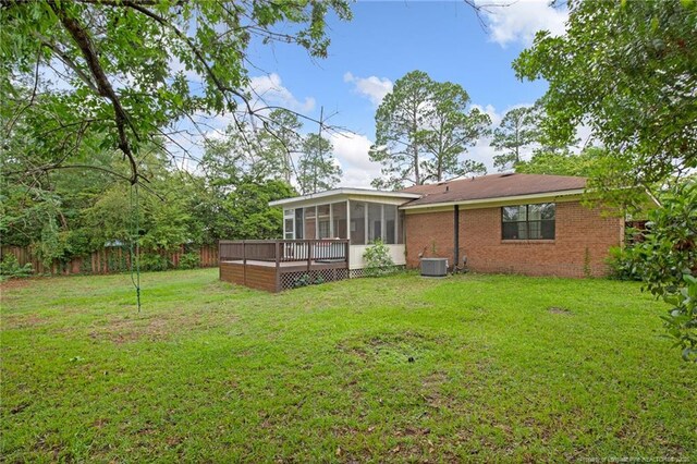 3855 Sturbridge Dr, Hope Mills, NC 28348 - back of property featuring a sunroom, central AC, a deck, and brick siding