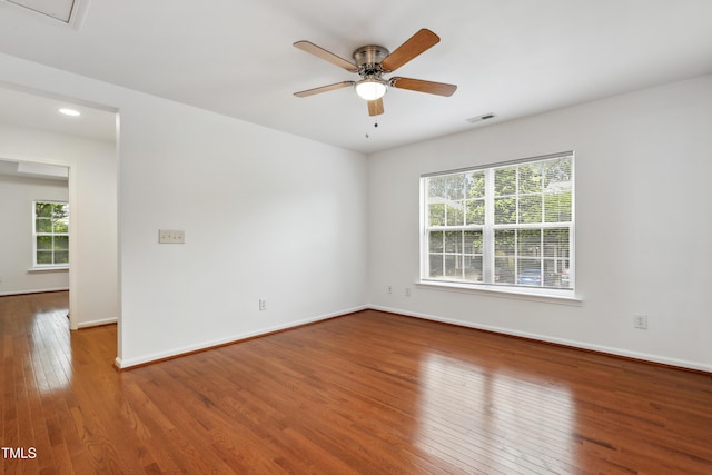 3141 Rapid Falls Rd, Cary, NC 27519 - empty room featuring wood-type flooring, plenty of natural light, a ceiling fan, and baseboards