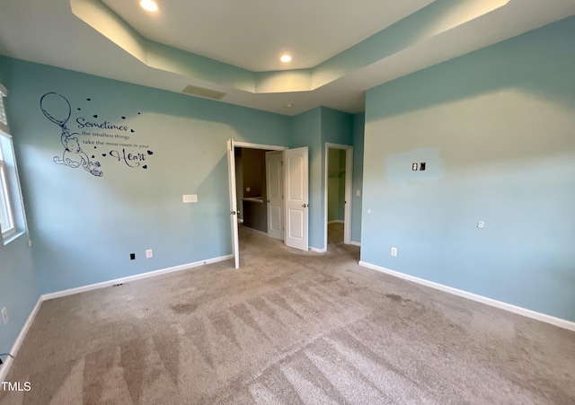 7241 Terregles Dr, Raleigh, NC 27617 - unfurnished bedroom with carpet flooring, a tray ceiling, baseboards, and recessed lighting