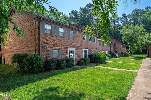 1220 Manassas Ct Unit B, Raleigh, NC 27609 - view of front of property with a front yard and brick siding