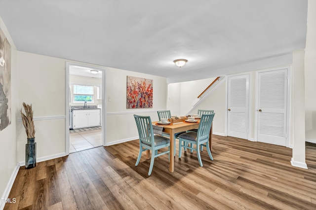 1220 Manassas Ct Unit B, Raleigh, NC 27609 - dining room with wood finished floors, stairs, and baseboards