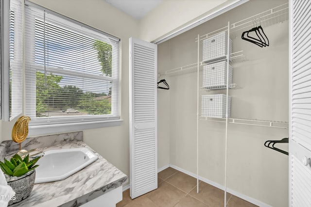 1220 Manassas Ct Unit B, Raleigh, NC 27609 - bathroom with a closet, plenty of natural light, vanity, and tile patterned flooring