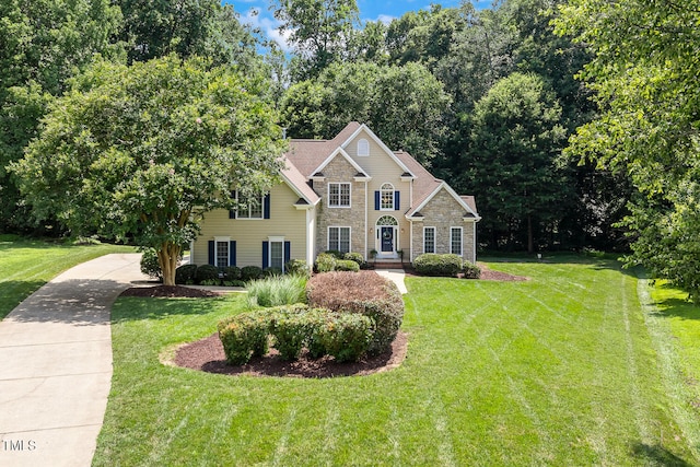 2628 Hunters Meadow Ln, Raleigh, NC 27606 - view of front of house featuring stone siding and a front yard