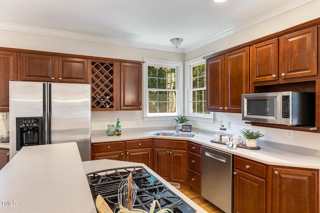 2628 Hunters Meadow Ln, Raleigh, NC 27606 - kitchen with stainless steel appliances, light countertops, crown molding, and light wood-style floors
