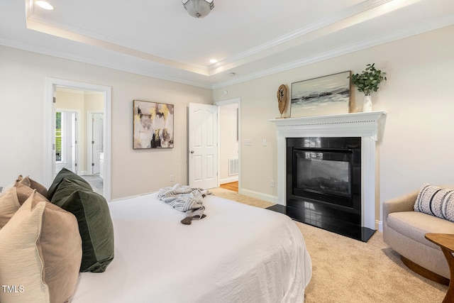 2628 Hunters Meadow Ln, Raleigh, NC 27606 - carpeted bedroom with a tray ceiling, a fireplace with flush hearth, ornamental molding, connected bathroom, and recessed lighting