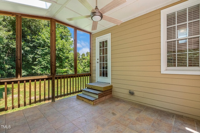 2628 Hunters Meadow Ln, Raleigh, NC 27606 - unfurnished sunroom with a ceiling fan, lofted ceiling, and a skylight
