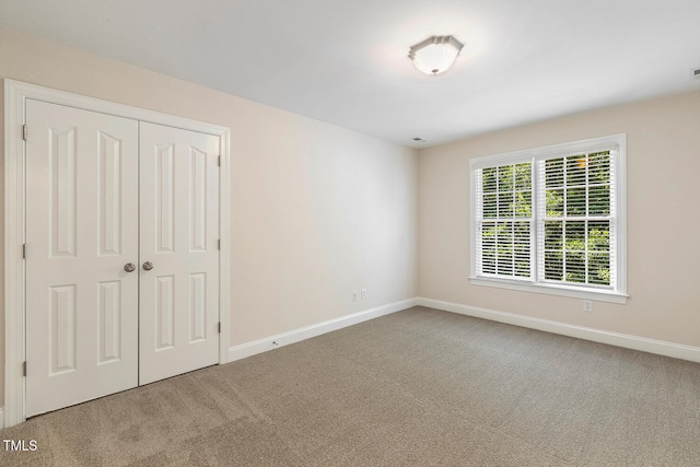 2628 Hunters Meadow Ln, Raleigh, NC 27606 - unfurnished bedroom featuring carpet flooring and a closet