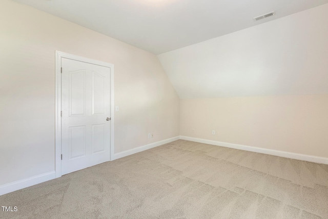 2628 Hunters Meadow Ln, Raleigh, NC 27606 - additional living space with light colored carpet and vaulted ceiling