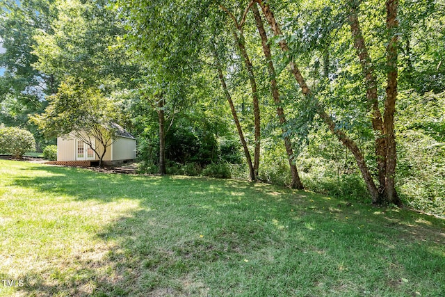 2628 Hunters Meadow Ln, Raleigh, NC 27606 - view of grassy yard with a shed