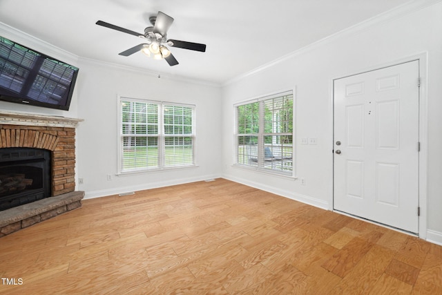 583 Old Home Place Ln, Durham, NC 27713 - unfurnished living room with light wood-type flooring, ornamental molding, a ceiling fan, baseboards, and a fireplace with raised hearth