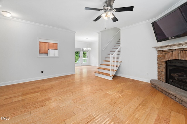 583 Old Home Place Ln, Durham, NC 27713 - unfurnished living room featuring stairway, a fireplace, a chandelier, light wood-type flooring, and ornamental molding