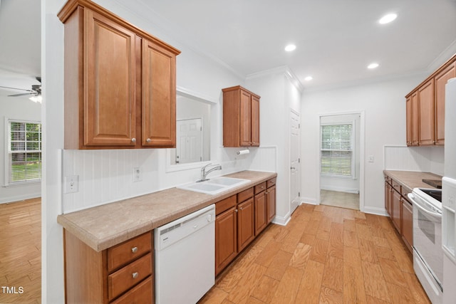 583 Old Home Place Ln, Durham, NC 27713 - kitchen with white appliances, a sink, light wood-style flooring, ornamental molding, and ceiling fan