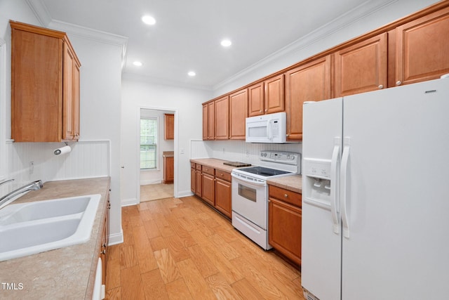 583 Old Home Place Ln, Durham, NC 27713 - kitchen with white appliances, a sink, light wood finished floors, light countertops, and ornamental molding