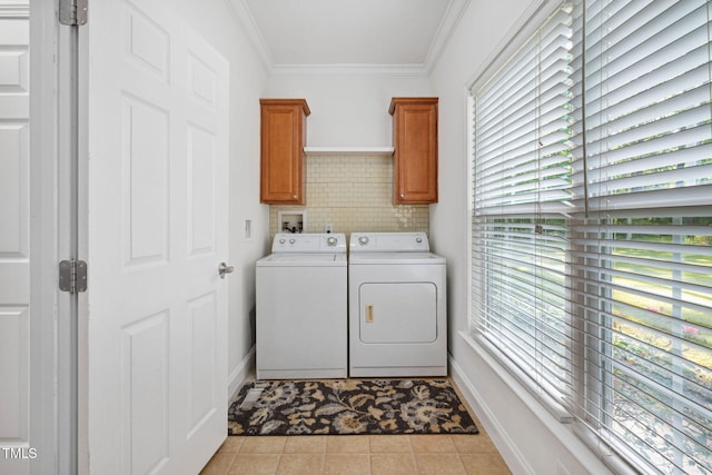 583 Old Home Place Ln, Durham, NC 27713 - laundry room featuring washer and clothes dryer, cabinet space, ornamental molding, light tile patterned floors, and baseboards