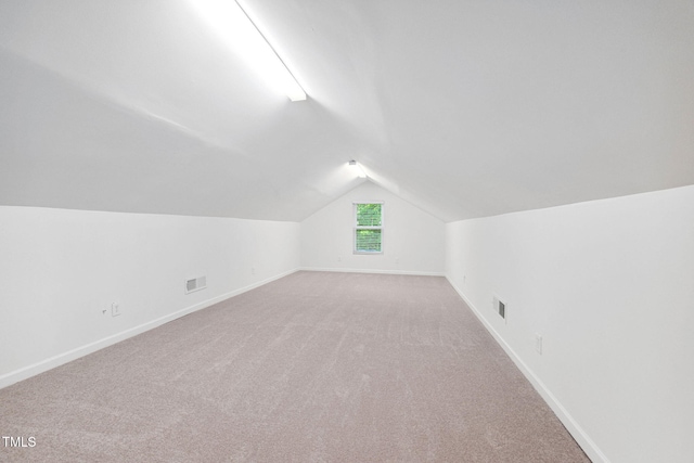 583 Old Home Place Ln, Durham, NC 27713 - additional living space featuring vaulted ceiling, light carpet, and baseboards