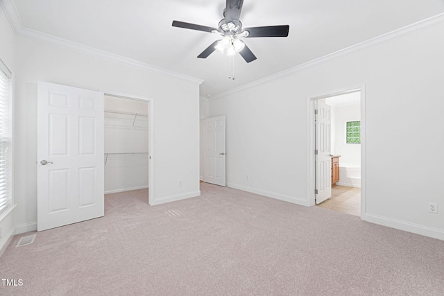 583 Old Home Place Ln, Durham, NC 27713 - unfurnished bedroom featuring crown molding, light colored carpet, a walk in closet, a closet, and baseboards
