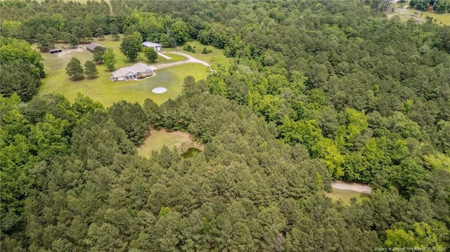 330 Wellington Rd, Saint Pauls, NC 28384 - aerial view of property and surrounding area with a heavily wooded area