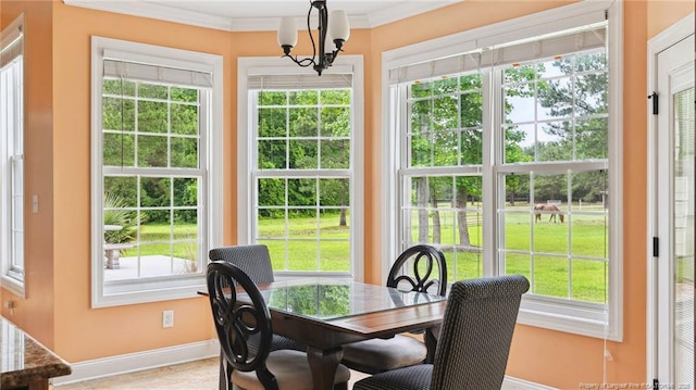 330 Wellington Rd, Saint Pauls, NC 28384 - dining area featuring plenty of natural light, a chandelier, and ornamental molding