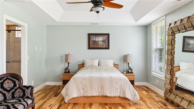 330 Wellington Rd, Saint Pauls, NC 28384 - bedroom featuring a tray ceiling and multiple windows