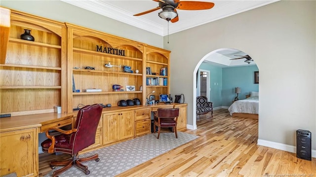 330 Wellington Rd, Saint Pauls, NC 28384 - office space with a ceiling fan, built in desk, arched walkways, light wood-type flooring, and crown molding