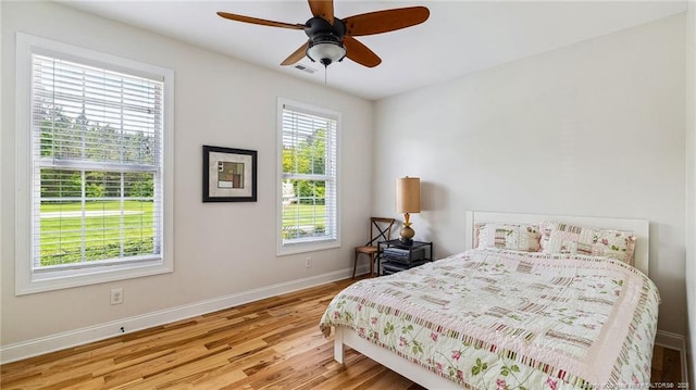 330 Wellington Rd, Saint Pauls, NC 28384 - bedroom with wood finished floors and ceiling fan