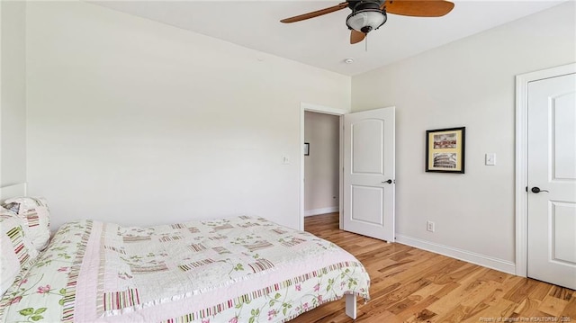 330 Wellington Rd, Saint Pauls, NC 28384 - bedroom with light wood finished floors and ceiling fan