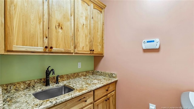 330 Wellington Rd, Saint Pauls, NC 28384 - kitchen featuring a sink and light stone counters
