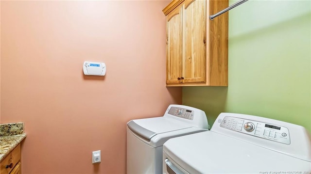 330 Wellington Rd, Saint Pauls, NC 28384 - laundry area featuring cabinet space and independent washer and dryer