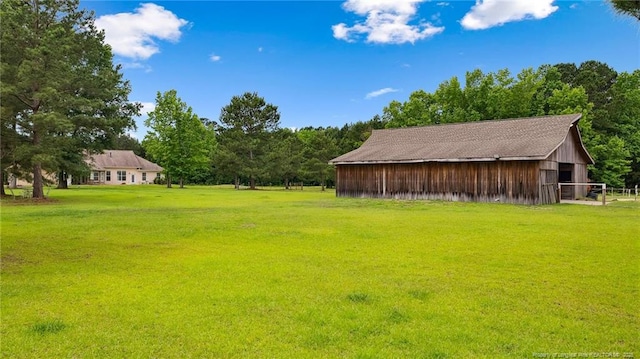 330 Wellington Rd, Saint Pauls, NC 28384 - view of grassy yard with an outbuilding and a barn