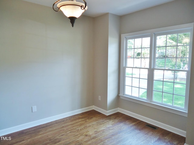 1104 Barrow Nook Ct, Apex, NC 27502 - spare room with wood finished floors and baseboards