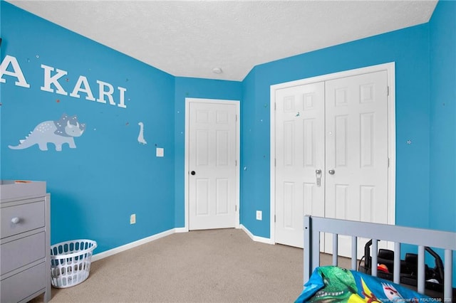 195 Cape Fear Rd, Raeford, NC 28376 - bedroom with baseboards, carpet floors, a closet, and a textured ceiling