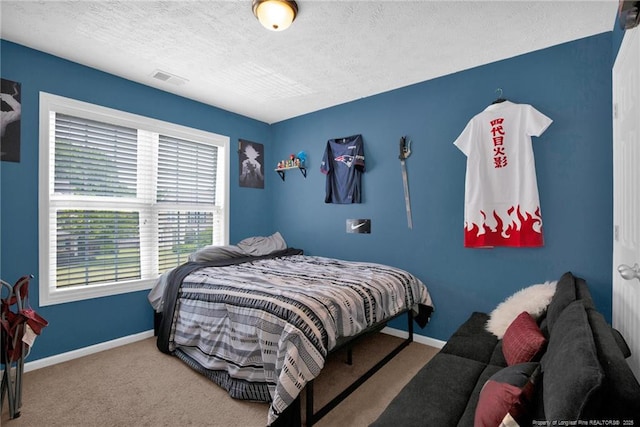 195 Cape Fear Rd, Raeford, NC 28376 - bedroom featuring a textured ceiling, carpet floors, and baseboards